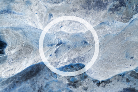 White flat circle on abstract stone background. Abstract psychedelic background.の写真素材