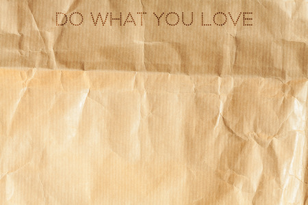 Do what you love. Inspiration card on crumpled paper background.の写真素材