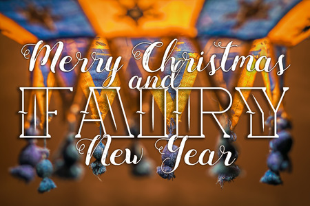 Merry Christmas and Cozy New Year congratulation on cozy festive backgroundの写真素材