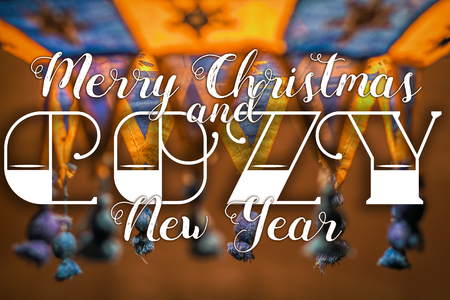 Merry Christmas and Cozy New Year congratulation on cozy festive backgroundの写真素材