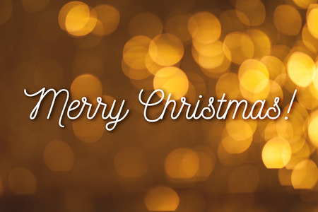 Merry Christmas congratulation on cozy festive bokeh backgroundの写真素材
