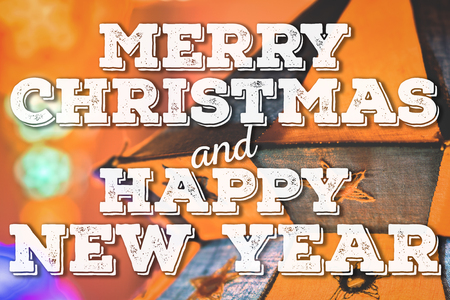 Merry Christmas and Cozy New Year congratulation on cozy festive backgroundの写真素材