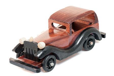 Vintage wooden toy car isolated from backgroundの写真素材