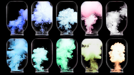 Luminous paint swirling in water. Splashes of paint in a glass jar. Psychedelic poster.の写真素材