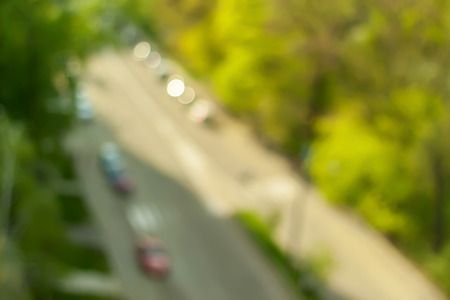 Road among trees. Blurry spring background.の写真素材