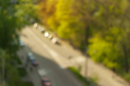 Road among trees. Blurry spring background.の写真素材