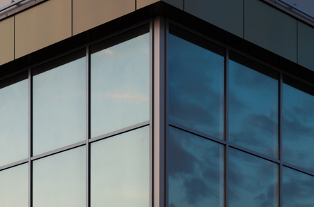 Sky reflected in a glass facadeの写真素材