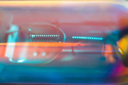 Blurry abstract futuristic wallpaper. Car headlight macro.