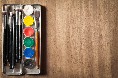 Professional cosmetic. Aqua make up in metal pallet. Usable expensive makeup brushes.の写真素材