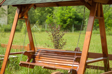 Wooden swing on the playgroundの写真素材