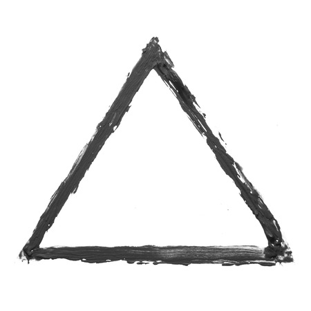 Black triangle drawn by gouache on a white backgroundの写真素材