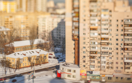 Architectural contrast. Little old house next to the huge modern home. Aerial view. Tilt-shift cityscapeの写真素材