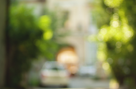 Blurred background photo.Cityscape bokeh. Defocused abstract city. Spring wallpaper.の写真素材