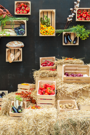 Vegetables and bread in wooden boxes. Autumn composition. Farm Productsの写真素材