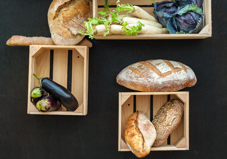Vegetables and bread in wooden boxes. Autumn composition. Farm Productsの写真素材