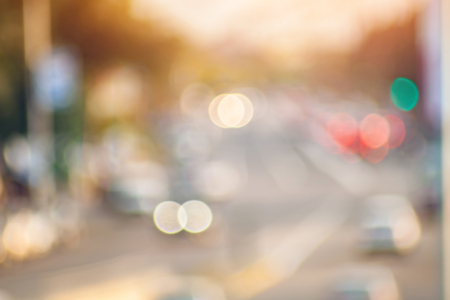 Blurred background photo. Summer blurry city backdrop.の写真素材