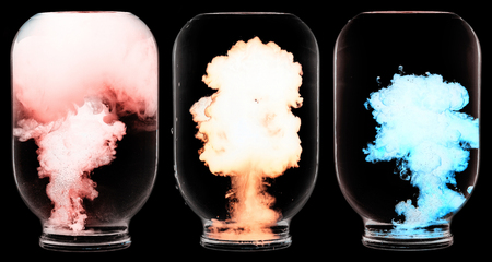 Luminous paint swirling in water.の写真素材