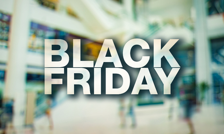 Black friday poster. Blurry shopping mall background.の写真素材
