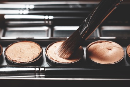 Brush and cream concealer. Cream concealer. Working with skin defectsの写真素材