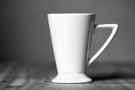 White mug on the wooden tableの写真素材