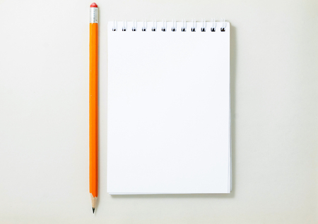 Top view of open spiral blank notebook on white backgroundの写真素材