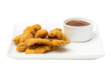 Chicken nuggets with ketchup on a square plateの写真素材