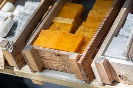 Handmade soap in wooden tray. A lot of slicesの写真素材