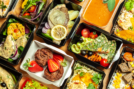 A lot of cardboard boxes with delicious and healthy foodの写真素材
