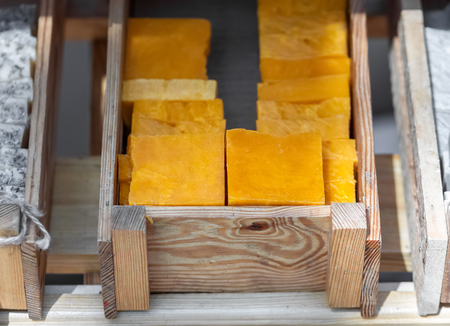 Handmade soap in wooden tray. A lot of slicesの写真素材