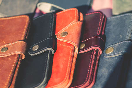A lot of leather wallets on the counter.の写真素材