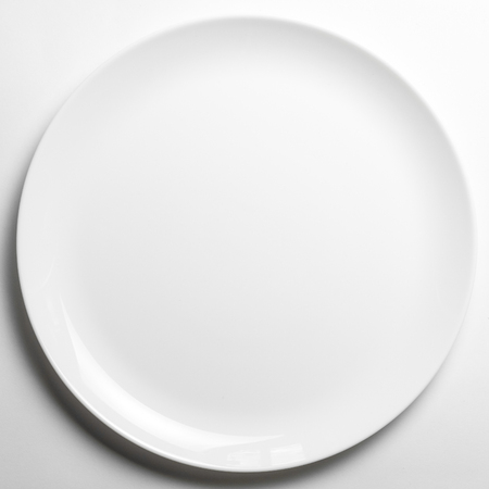Whte plate without print on white backgroundの写真素材