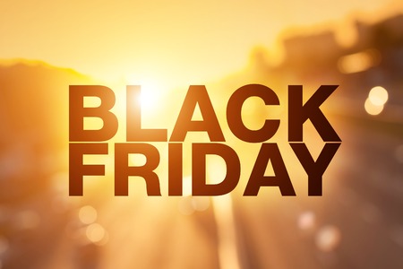 Black friday poster. Blurry sunset cityscape on backgroundの写真素材