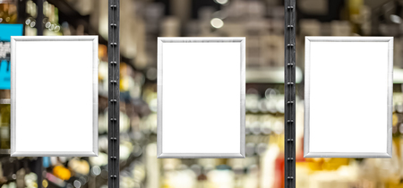 Blank white posters in aluminium frames. Glassy showcase on the street. Background for mockupの写真素材