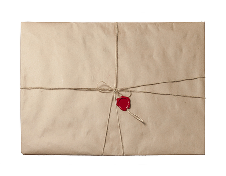 Recycled brown paper packaging tied with twine and sealed with red sealing wax.の写真素材