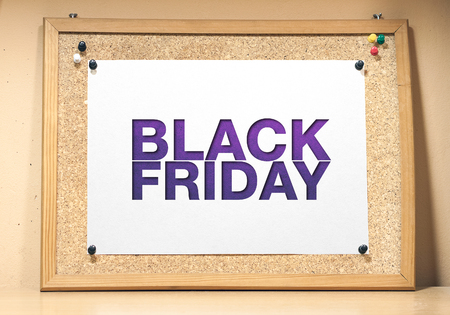 Black friday poster. A cork board with a white sheet of paper.の写真素材
