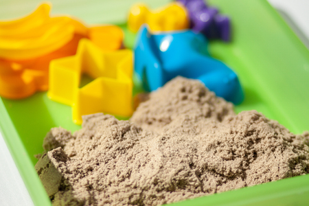 Kinetic sand close-up. Plastic molds for the game with kinetic sand.の写真素材