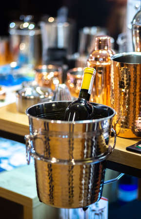 metal ice bucket with bottle of wineの写真素材