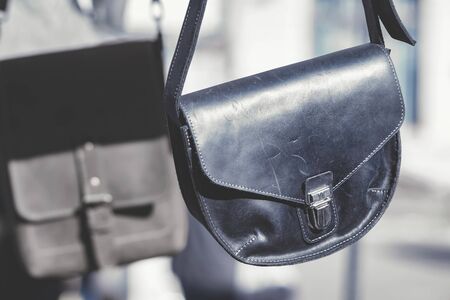 Black leather bag with a metal claspの写真素材