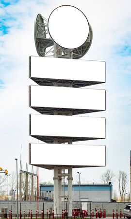 Giant advertising stand with four horizontal and one round empty boardsの写真素材