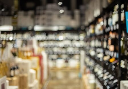 Blurry liquor store. Defocused alcohol shop backgroundの写真素材