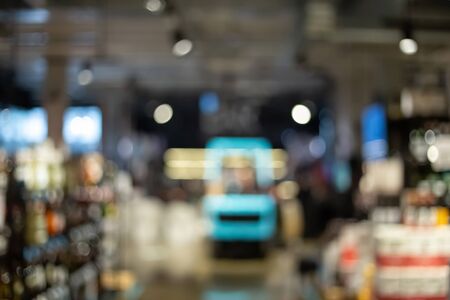 Blurry liquor store. Defocused alcohol shop backgroundの写真素材