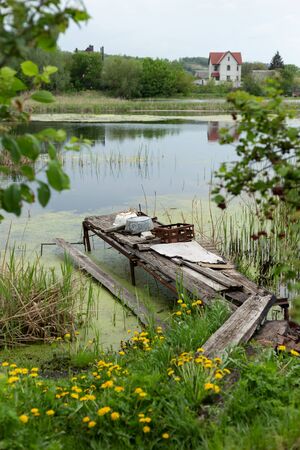 Abandoned boat pier in the swamp covered with mudの写真素材