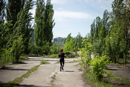 Pripyat, Ukraine, May 20, 2019. Running girl on Pripyat main squareのeditorial素材