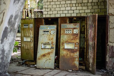 Pripyat, Ukraine, May 20, 2019. Rusty broken water dispensing wending machines.