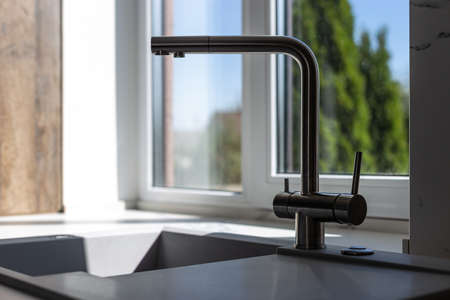 Expensive luxury kitchen sink with faucetの写真素材