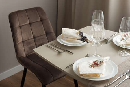 Served table in modern dining room. Interior design details close-up.の写真素材
