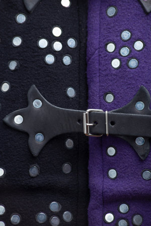 Close-up of Medieval Brigandine Details. Detailed view of studded plates, leather strap, and metal buckle on a sleeveless body armor.の写真素材