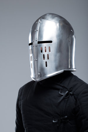 Closed Medieval Helmet with Slits. Polished silver helmet fully enclosing the head with vertical and horizontal viewing slits.の写真素材