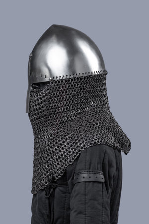 Simple Norman Helmet with Nasal Bar and Chainmail. Classic medieval head protection featuring a central nose guard and attached chainmail neck cover.の写真素材
