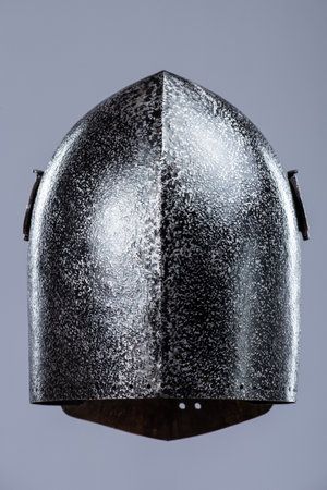 Darkened Steel Medieval Knight Helmet. Battle-worn head protection with narrow eye slits.の写真素材